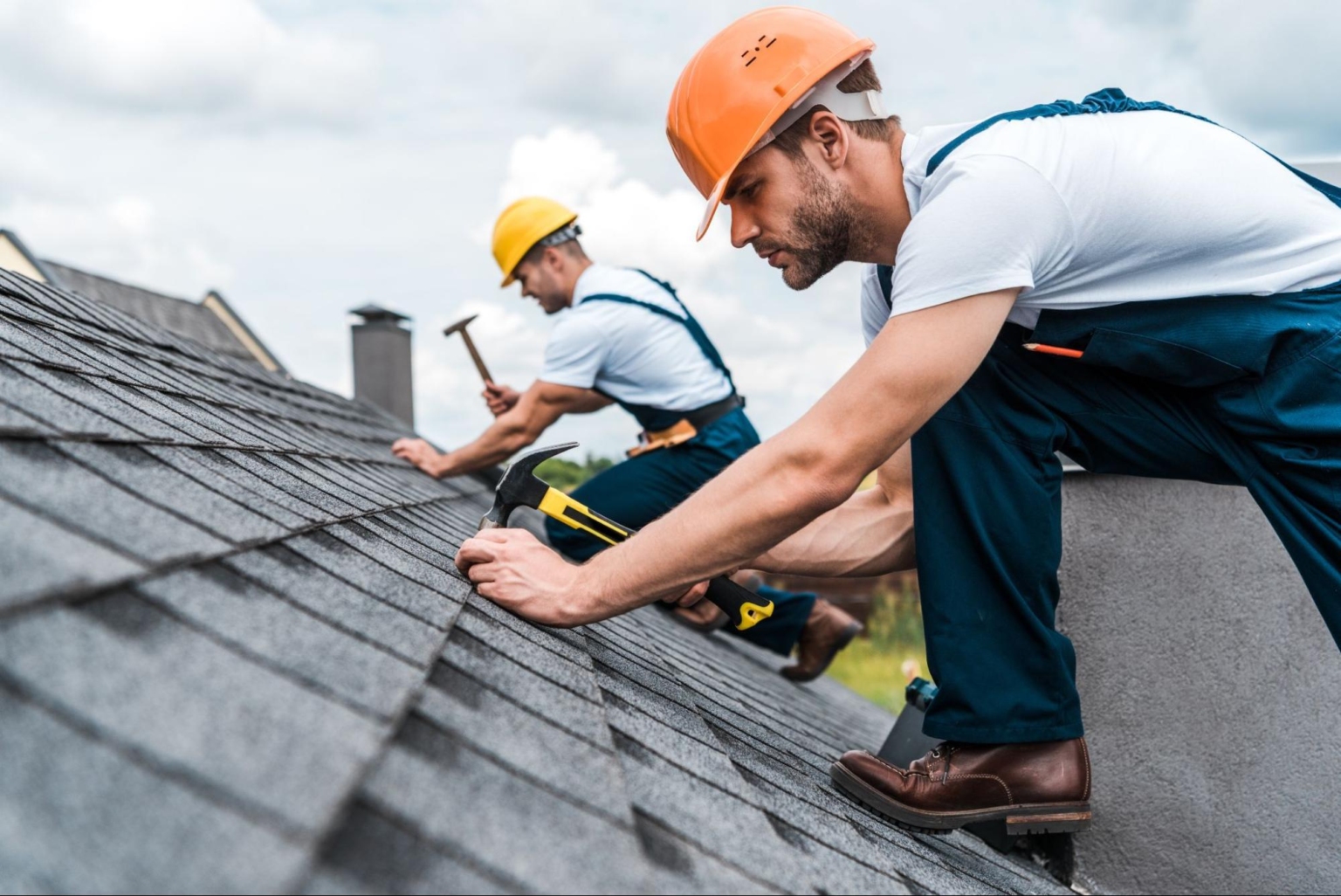 Roofer working on a roof in Norwich